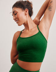 green racerback cropped tank top with slim spaghetti straps.