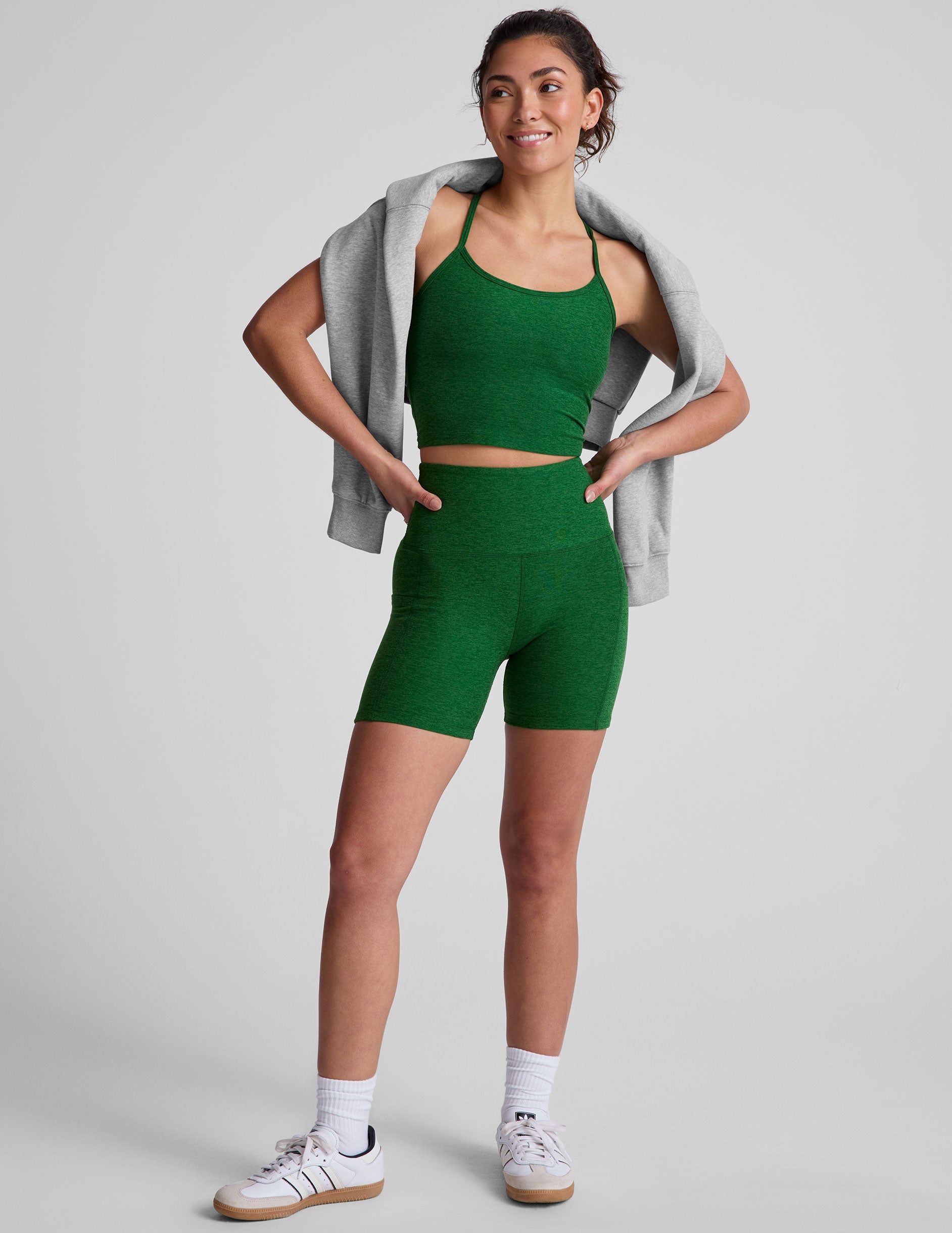 green racerback cropped tank top with slim spaghetti straps.