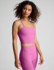 pink racerback cropped tank with slim straps.
