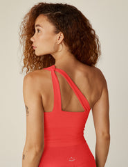 red one-shoulder cropped tank with an cut-out detail on the front strap and a twist detailing on the back strap.