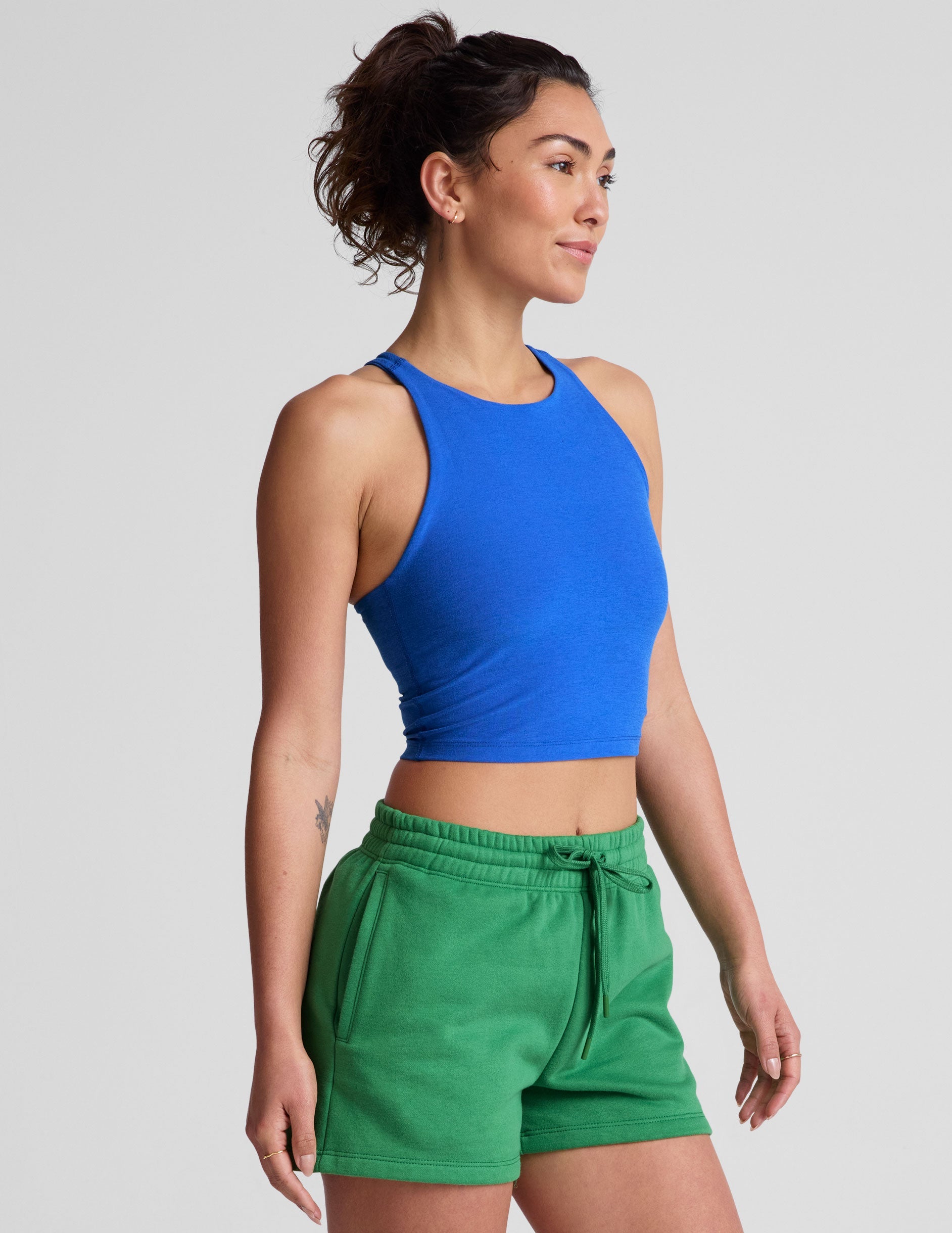 blue high-neck racerback cropped length tank top.