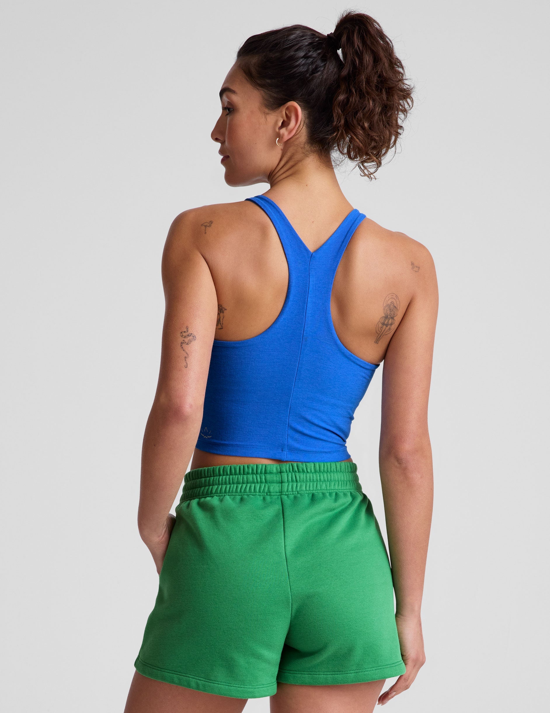 blue high-neck racerback cropped length tank top.