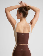 brown square neck cropped tank with white straps and white outlining down the sides.