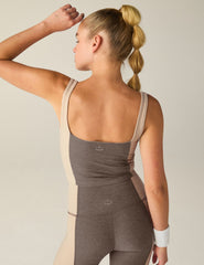 brown square neck cropped tank top with white lining on the sides.