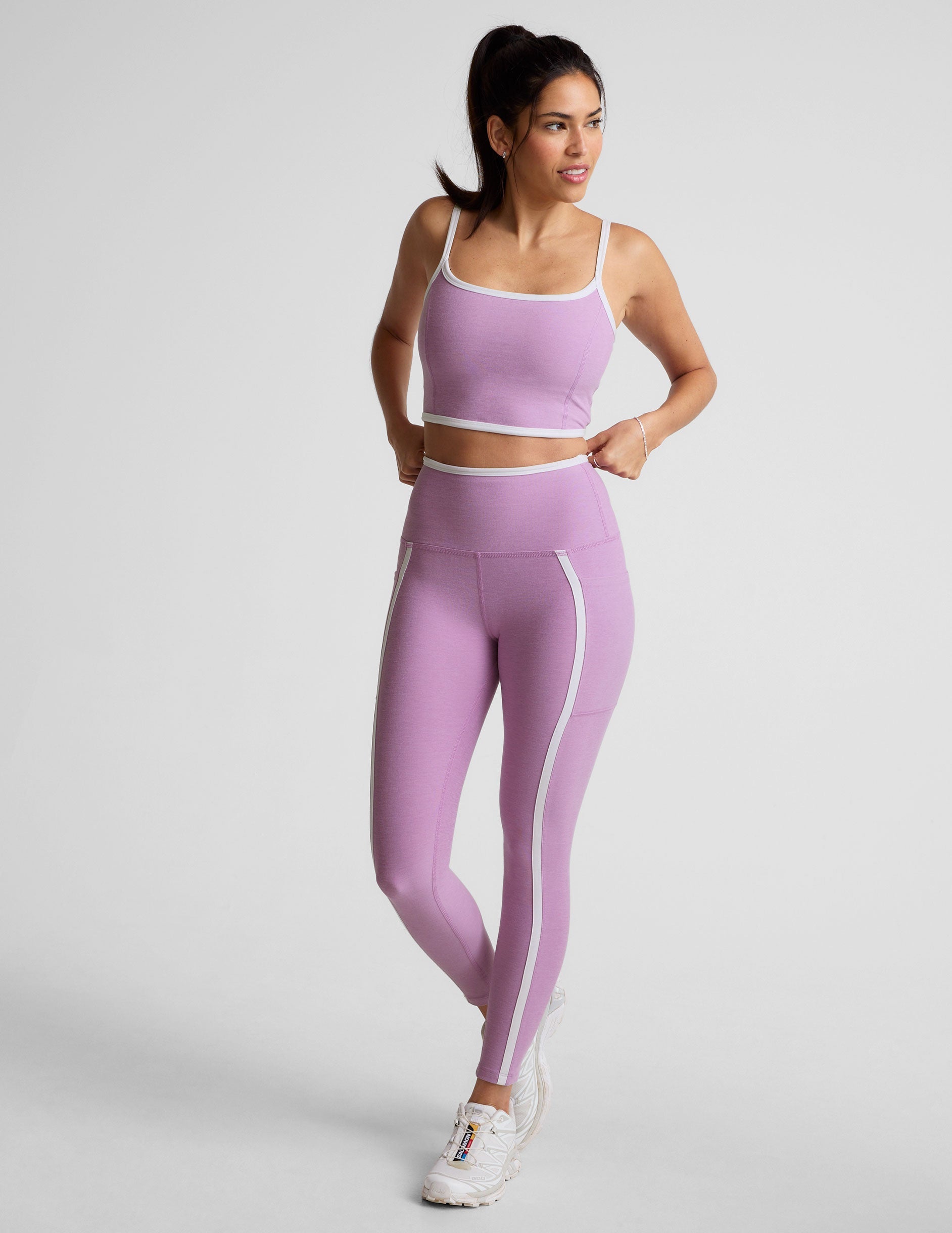 purple cropped tank with princess seams and white piping along edges.