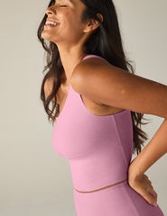 pink one-shoulder cropped tank top.