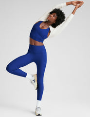 blue cropped tank top with a front and back v neckline.