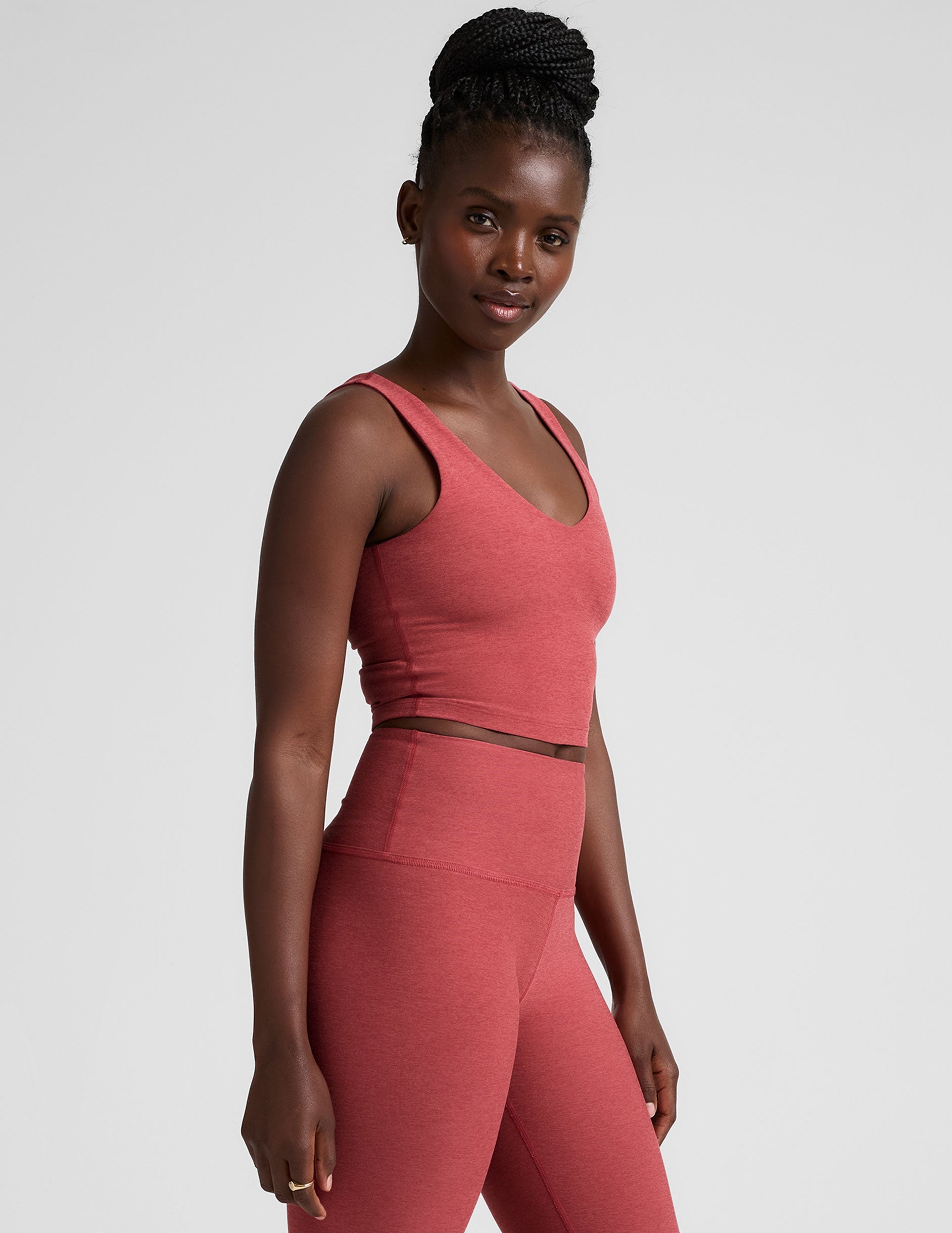 red cropped tank top with a front and back v neckline.