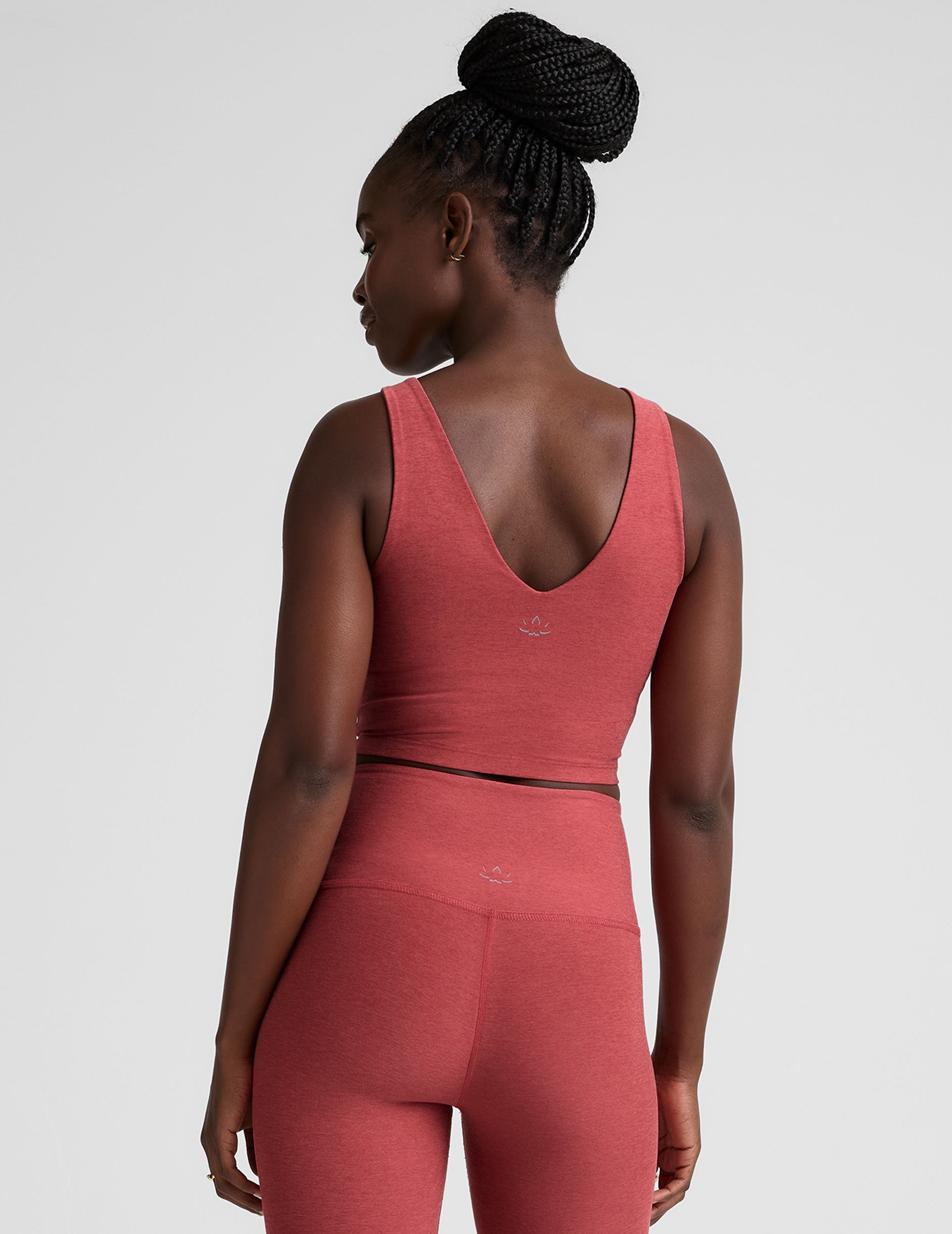 red cropped tank top with a front and back v neckline.