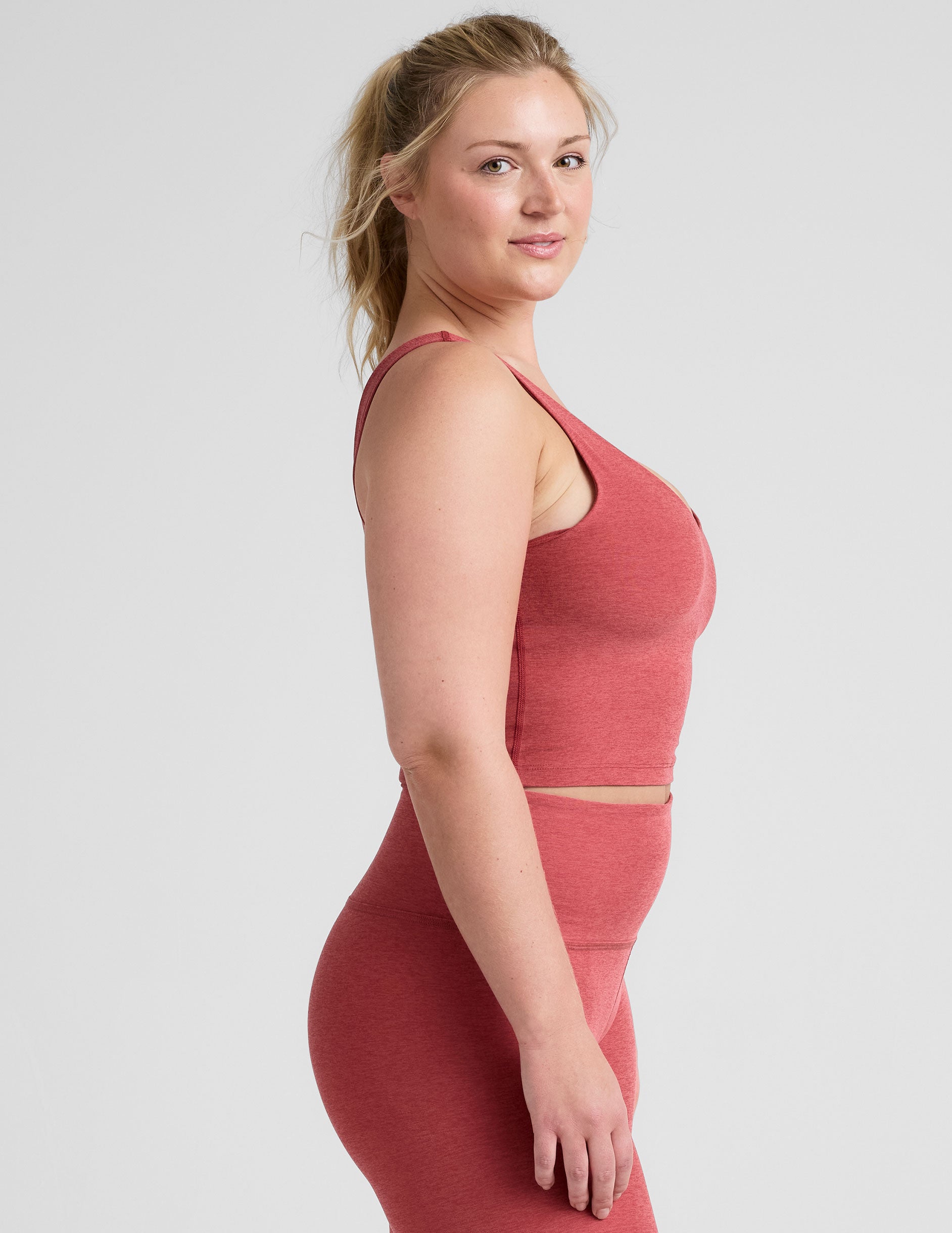 red cropped tank top with a front and back v neckline.