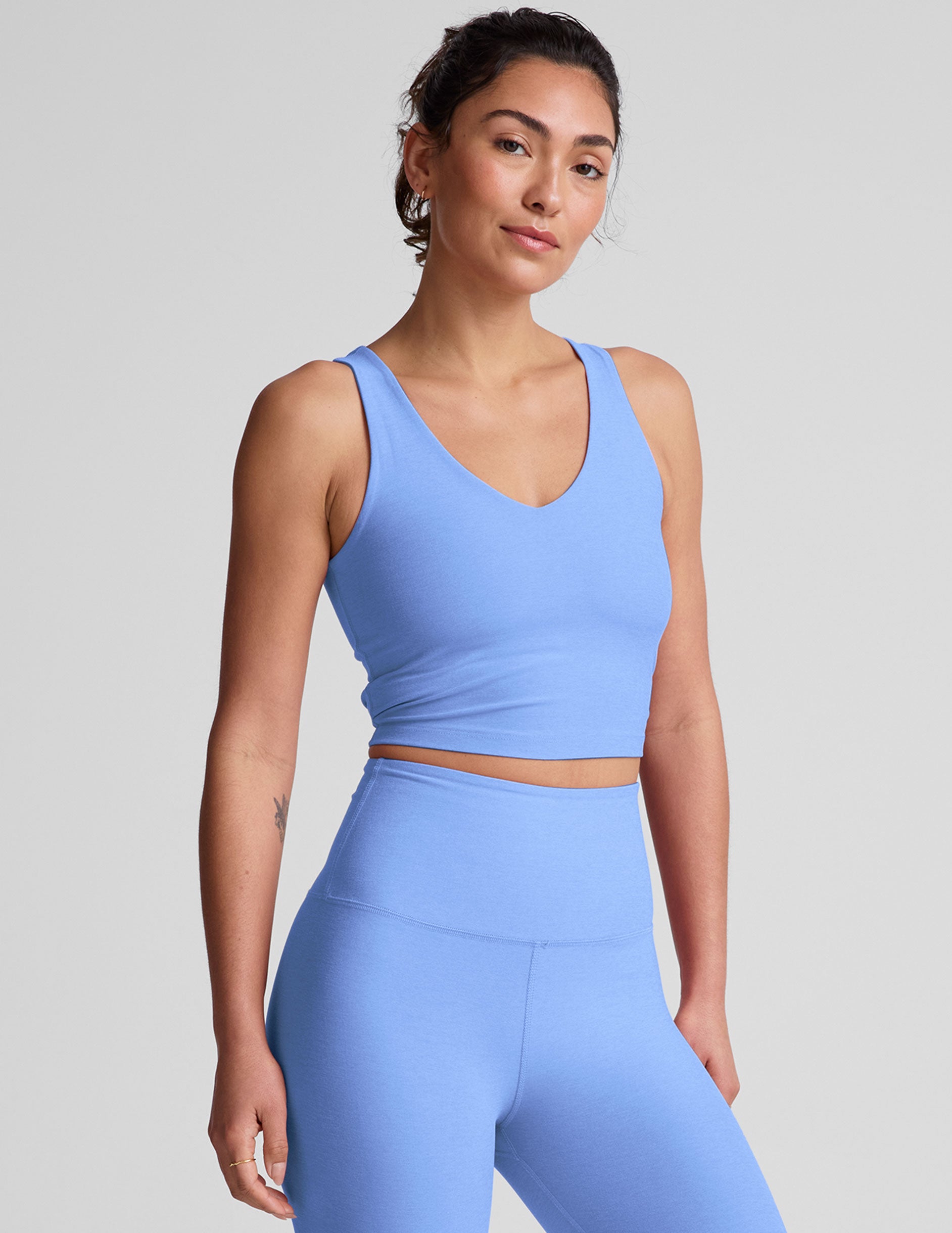 blue v-neck cropped tank top.