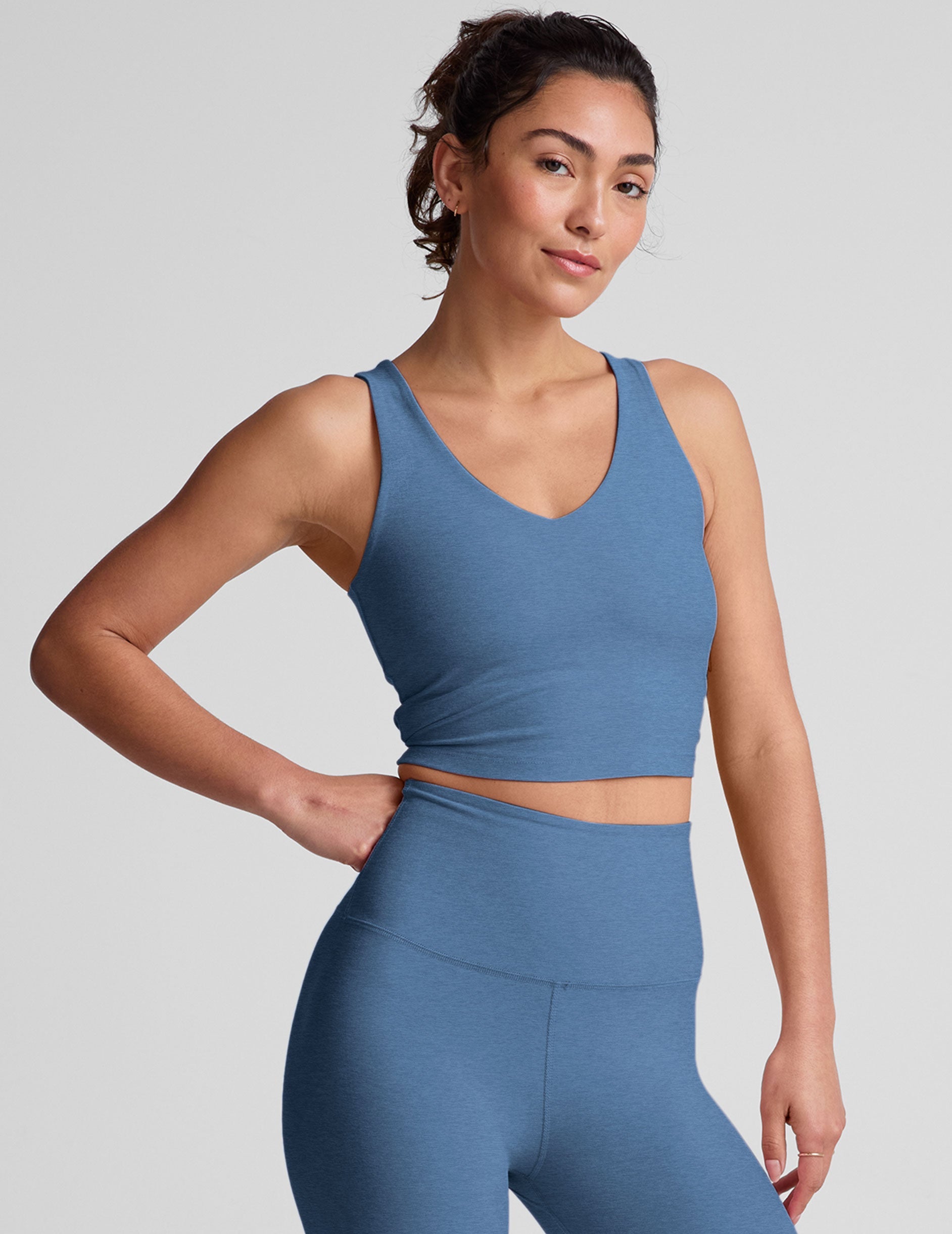 blue cropped tank with a soft front and back v neckline.