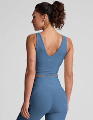 blue cropped tank with a soft front and back v neckline.