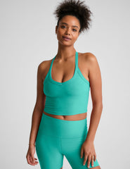blue v-neck cropped tank top with a wide racerback detail.
