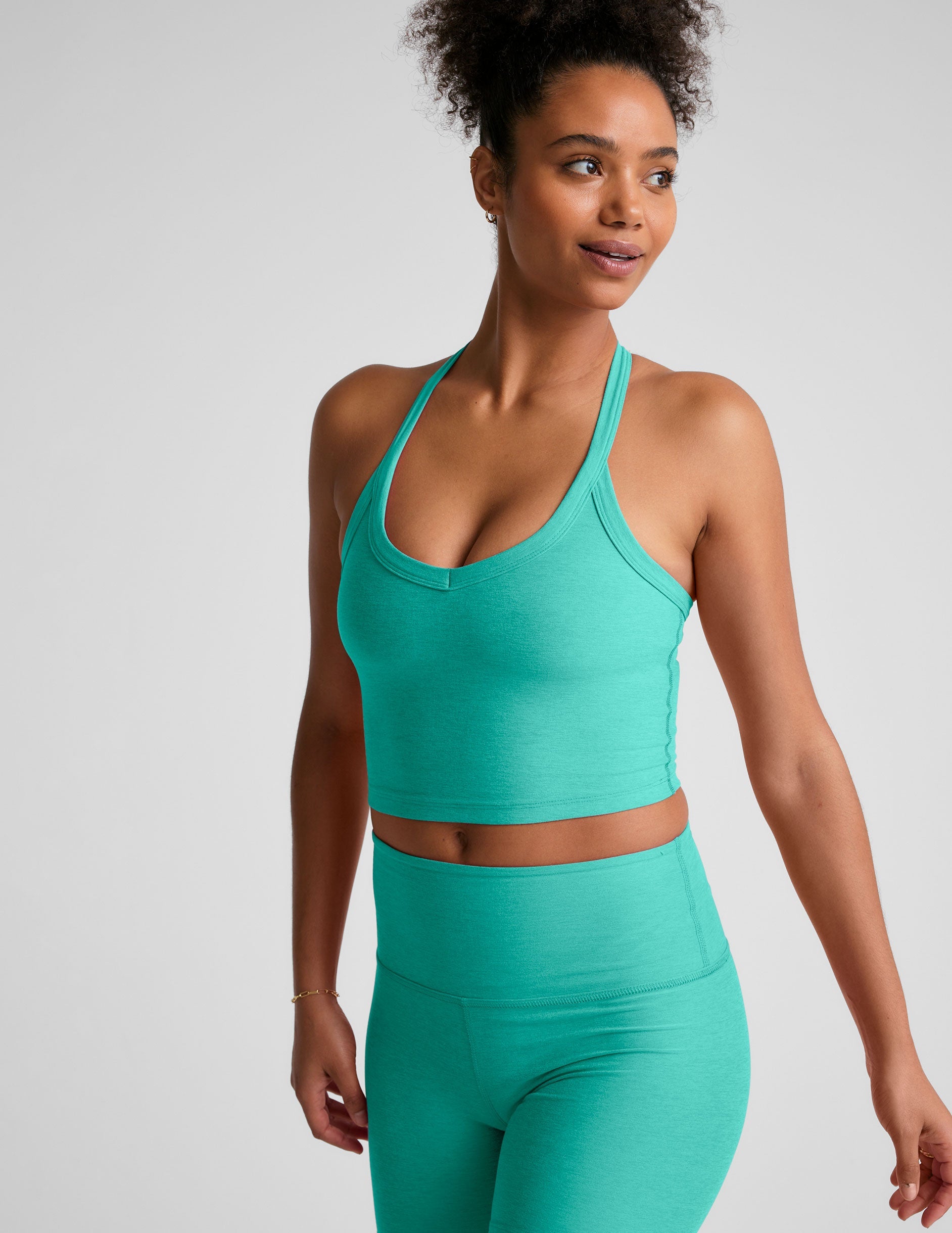 blue v-neck cropped tank top with a wide racerback detail.