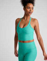 blue v-neck cropped tank top with a wide racerback detail.