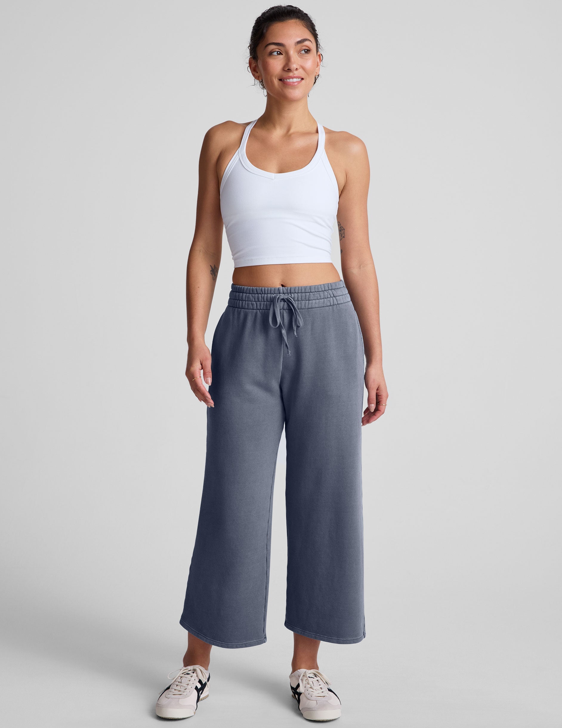 white cropped tank top with a v neckline and high racerback.