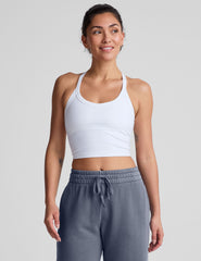 white cropped tank top with a v neckline and high racerback.