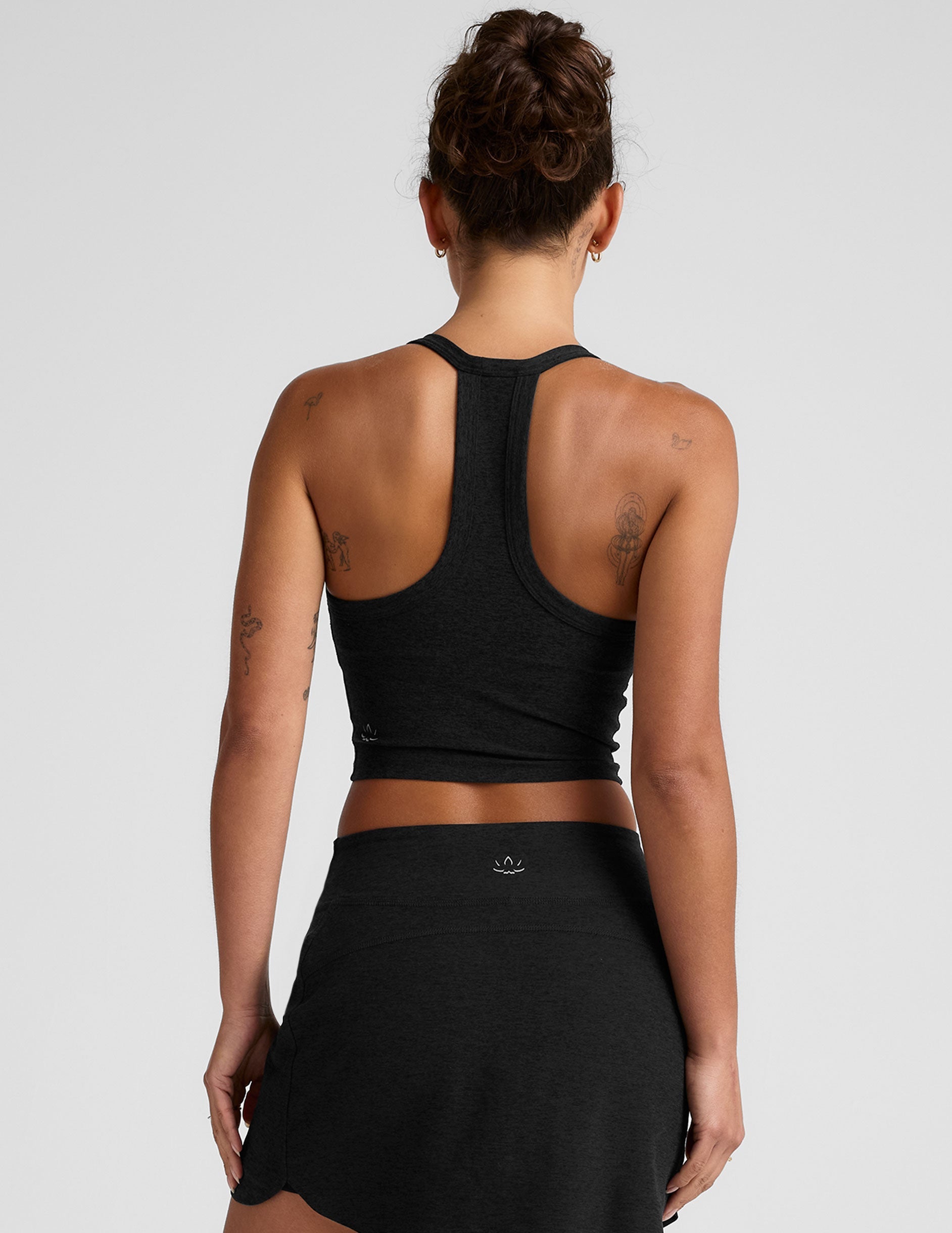 black cropped tank with a v-neckline and high racerback.