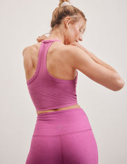 pink cropped high racerback tank with a v neckline.