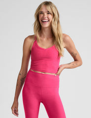 pink cropped tank top with a v-neckline and high racerback.
