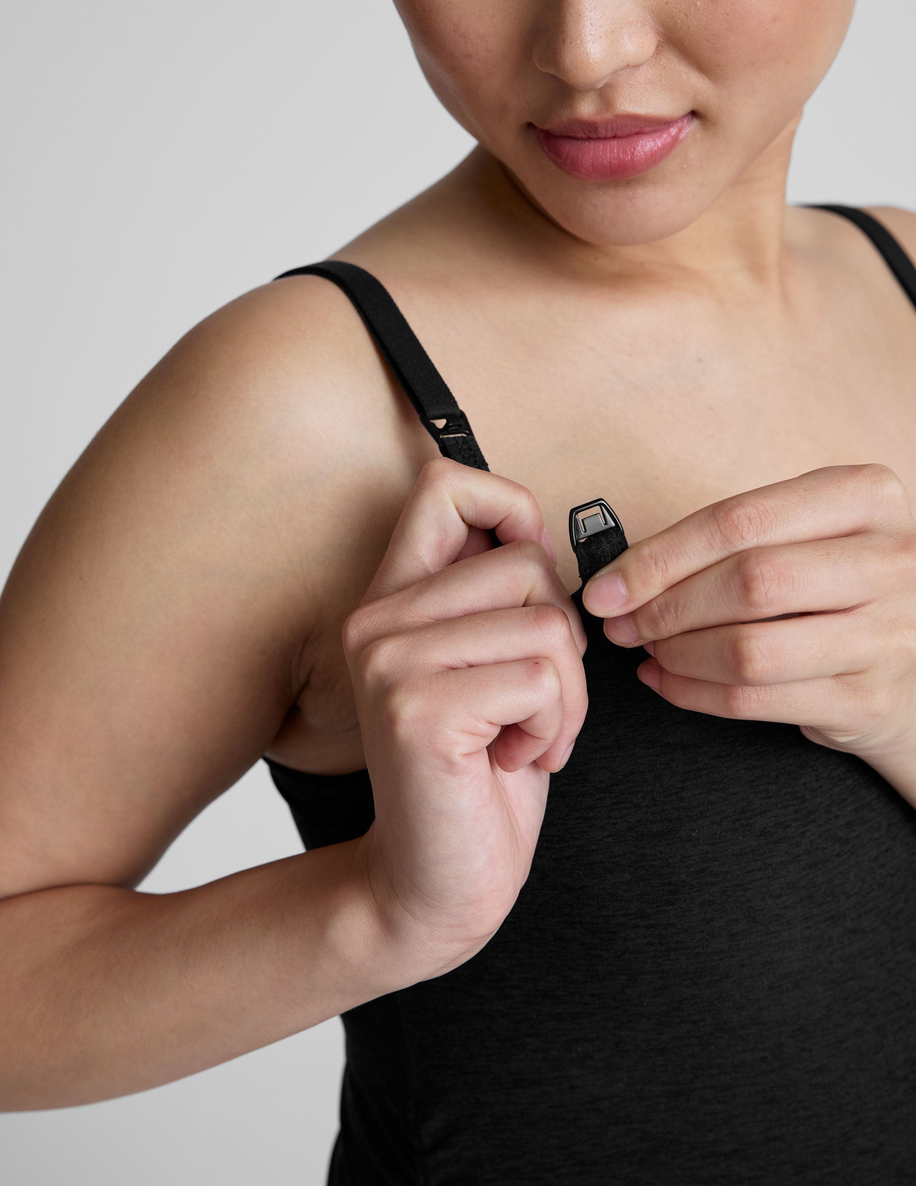 black nursing tank with adjustable straps.