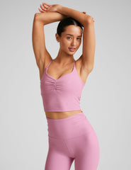 pink cropped tank with shirred detailing at center front, sweetheart neckline, and adjustable straps.