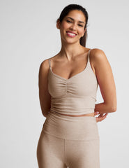 brown cropped tank with shirred detailing at center front, sweetheart neckline, and adjustable straps. 