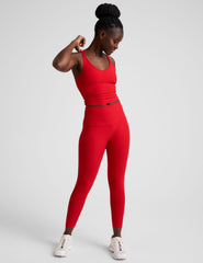 red v-neck cropped tank top with back crossover straps.