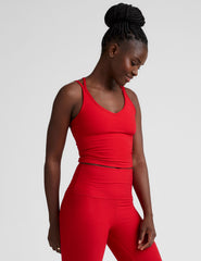 red v-neck cropped tank top with back crossover straps.