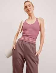 pink v-neck tank top with criss cross back straps.