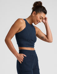 blue cropped tank with a high neck with center front zipper.