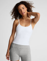 white midway length tank with adjustable spaghetti straps.