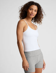 white midway length tank with adjustable spaghetti straps.