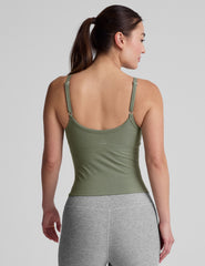 green waist length tank top with adjustable straps.