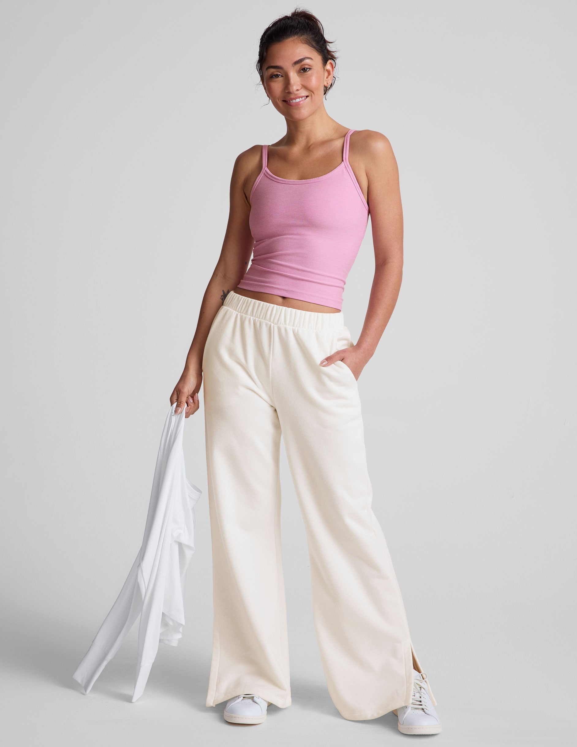 pink waist length tank with adjustable spaghetti straps.