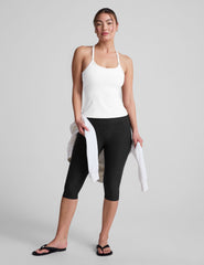 white midway length tank with adjustable spaghetti straps.