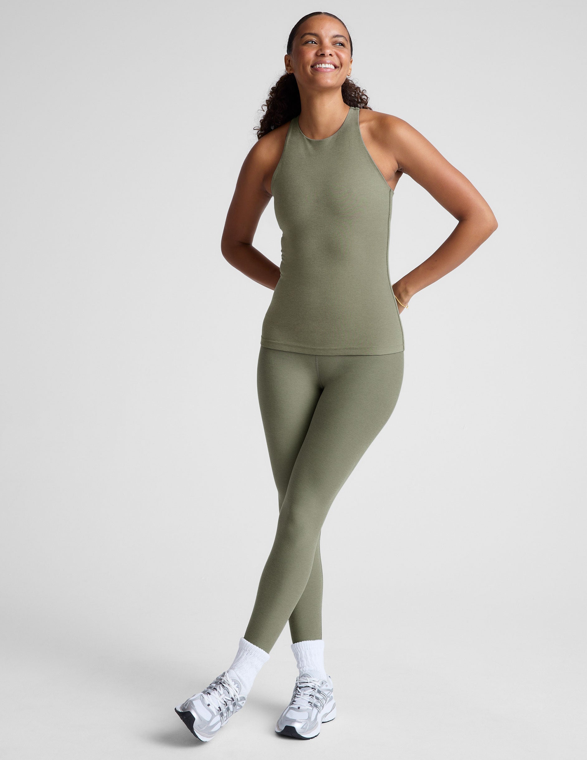 grey classic length racerback tank top with a high scoop neckline.