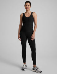black waist length tank top with a front and back v neckline.