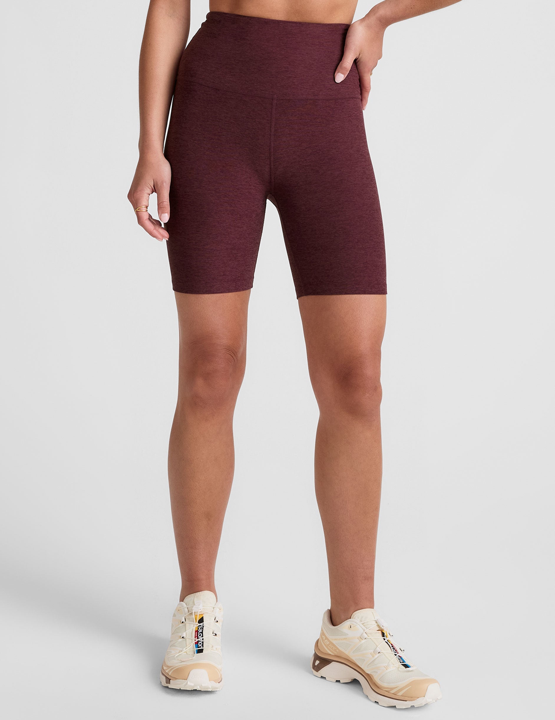 model is wearing red high-waisted 7" inseam biker shorts. 