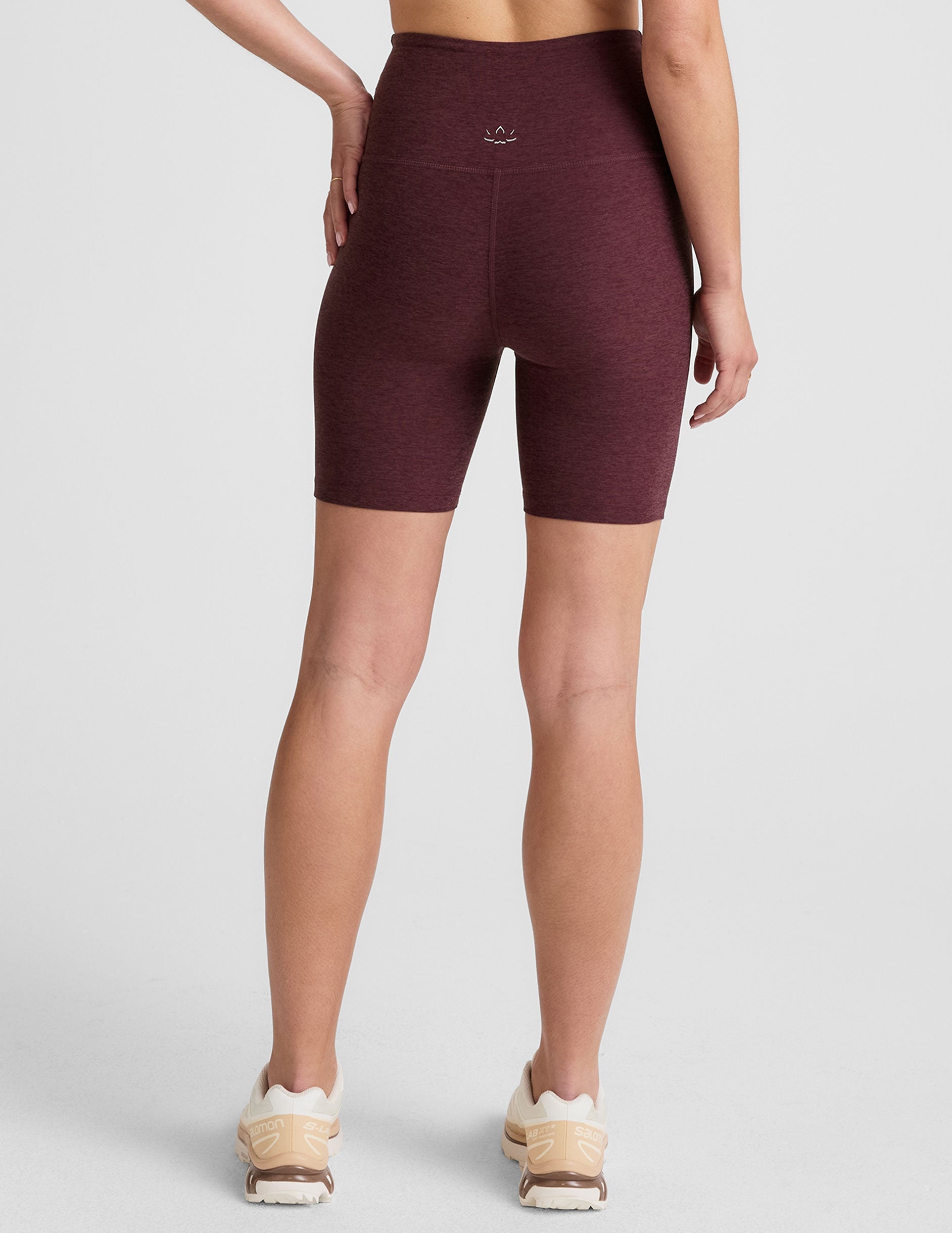 model is wearing red high-waisted 7" inseam biker shorts. 