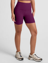 purple high-waisted, 5" inseam biker shorts. 