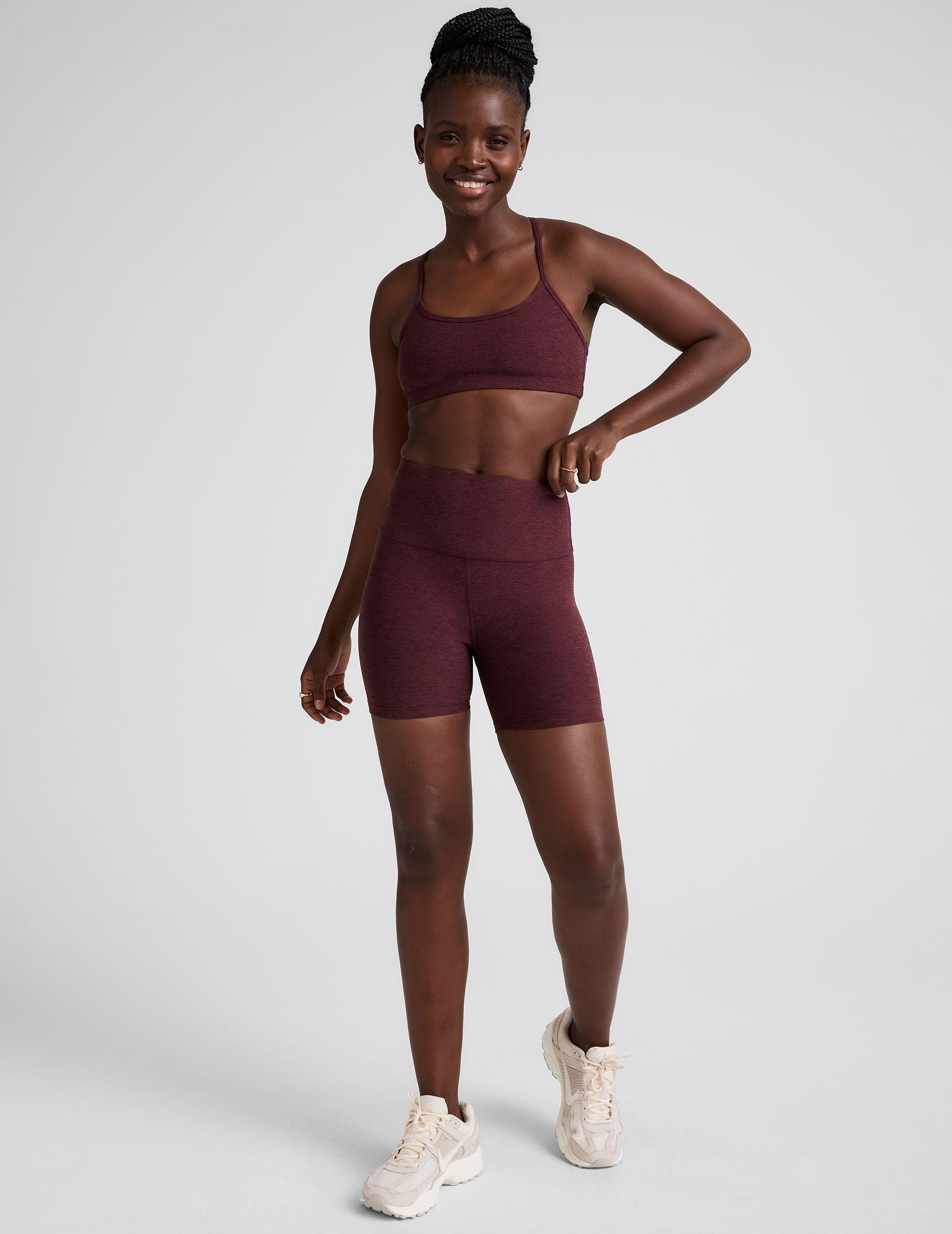 model is wearing red high-waisted 5" inseam biker shorts. 