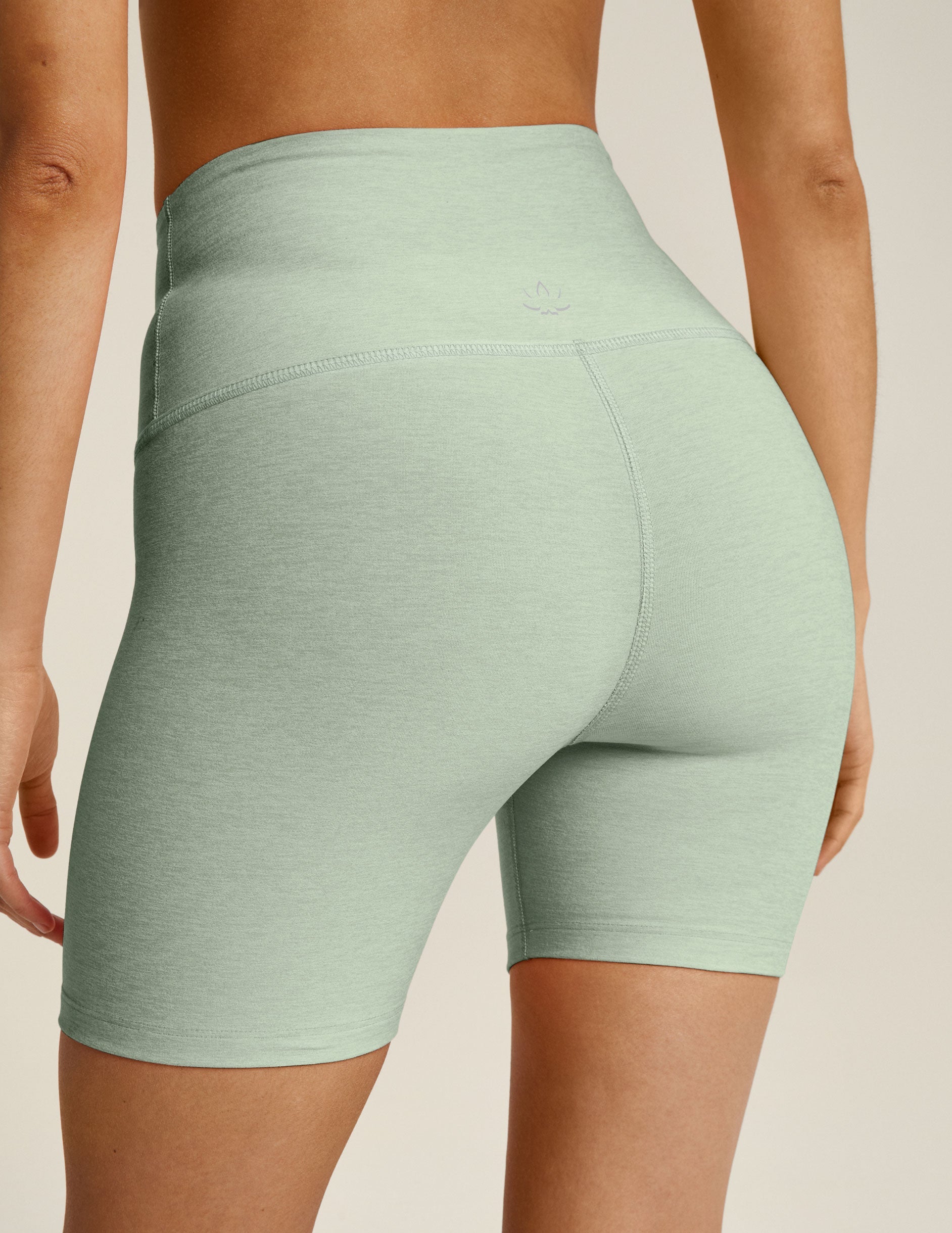 green high-waisted biker shorts with a 5" inseam. 