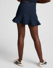 blue high-waisted skirt with a ruffle hem and built-in shorts with pockets.