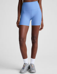 blue high-waisted 5" inseam biker shorts with side pockets. 