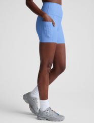 blue high-waisted 5" inseam biker shorts with side pockets. 