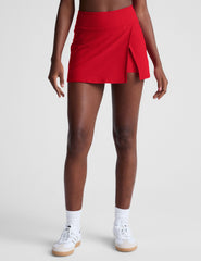 red mini skirt with built-in shorts and a front side slit.
