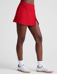 red mini skirt with built-in shorts and a front side slit.