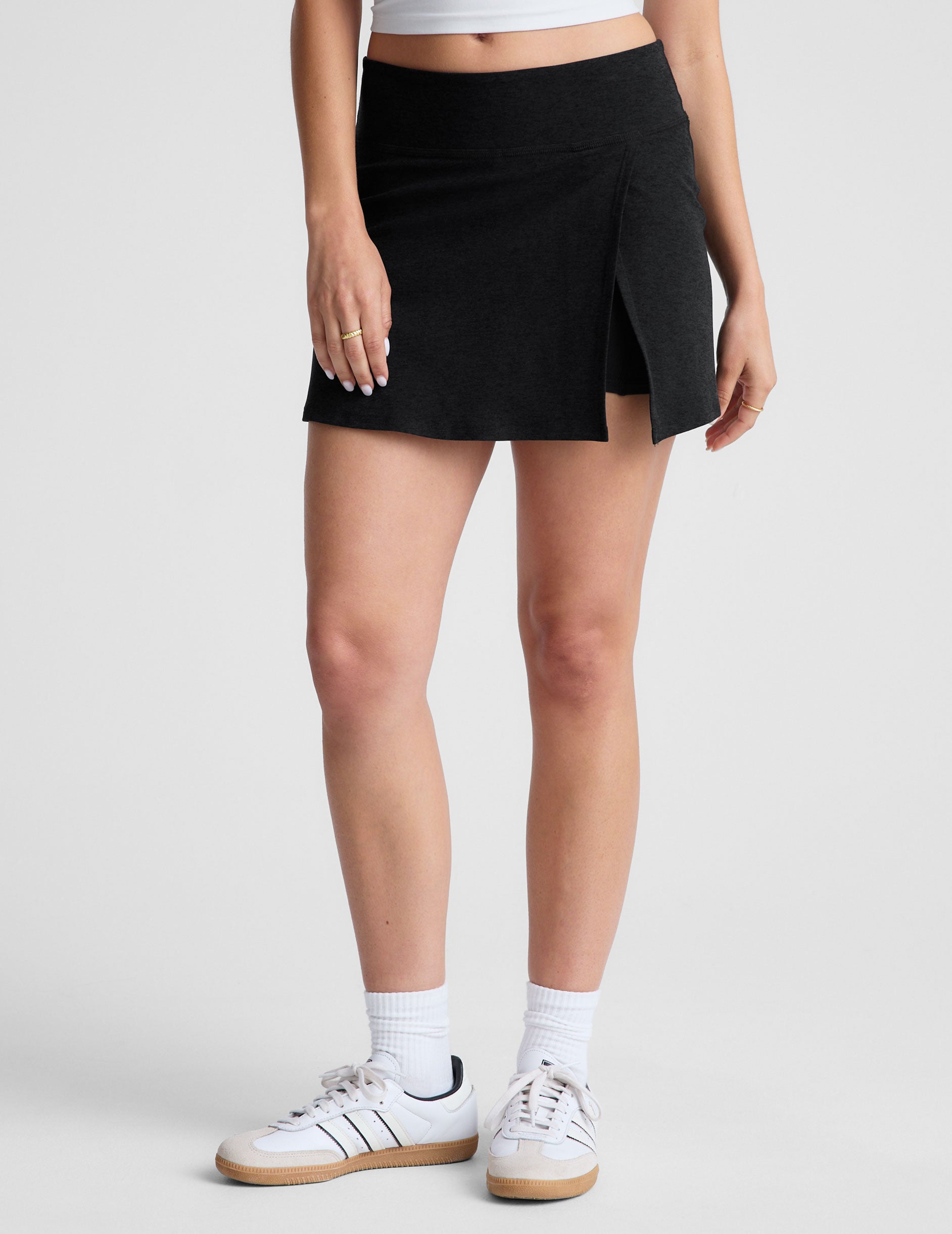 black mini skirt with slit at sides